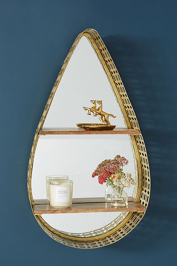 gold teardrop wall mirror with shelves