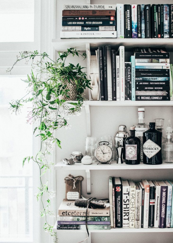 bar station in a bookcase for entertaining in a small space