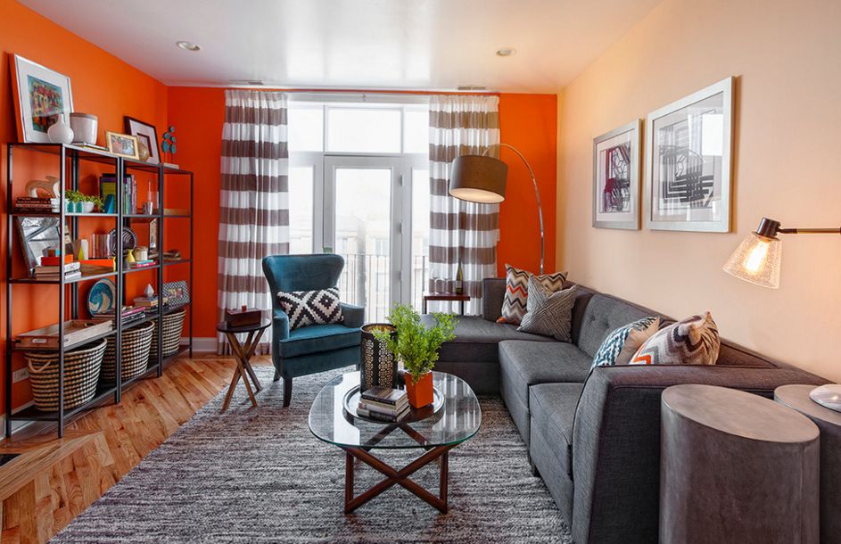bold orange accent walls in small living room