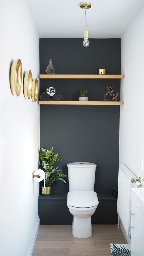 dark blue accent wall in small bathroom