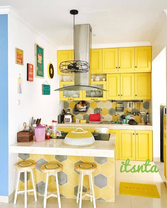bold yellow cabinets in small kitchen