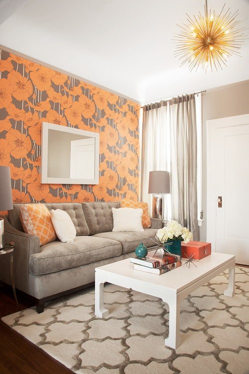 large orange floral wallpaper in a small living rooms