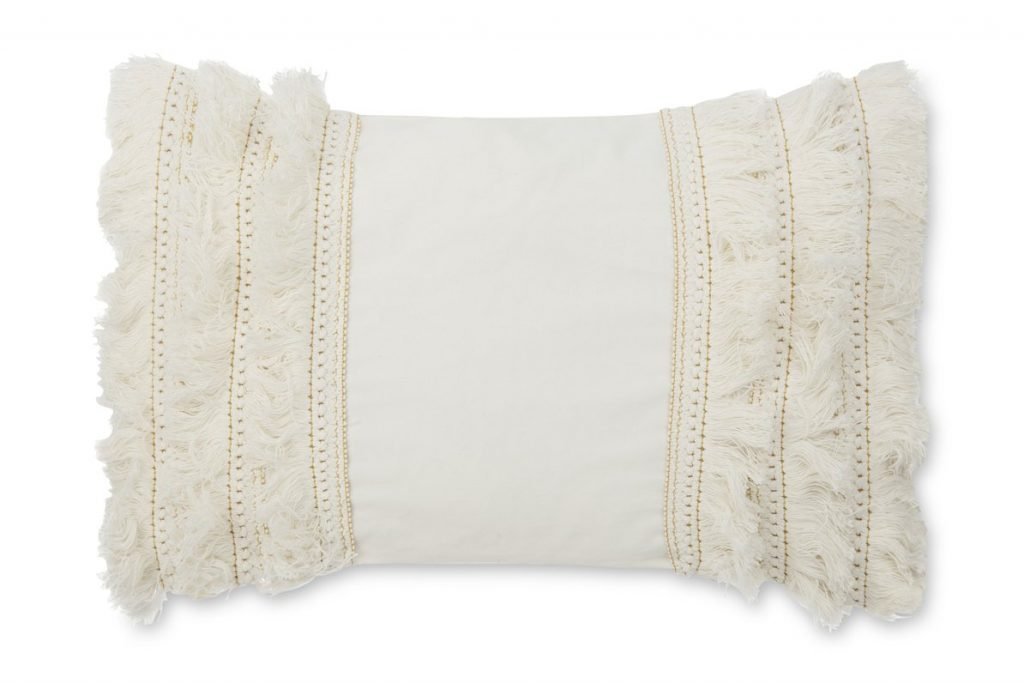 cream fringe accent pillow