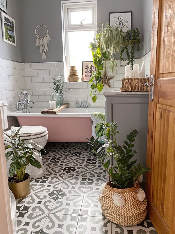 gray and white bathroom with plants