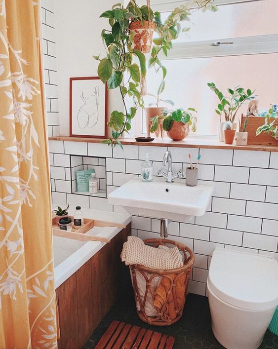 warm plant filled small bathroom decor