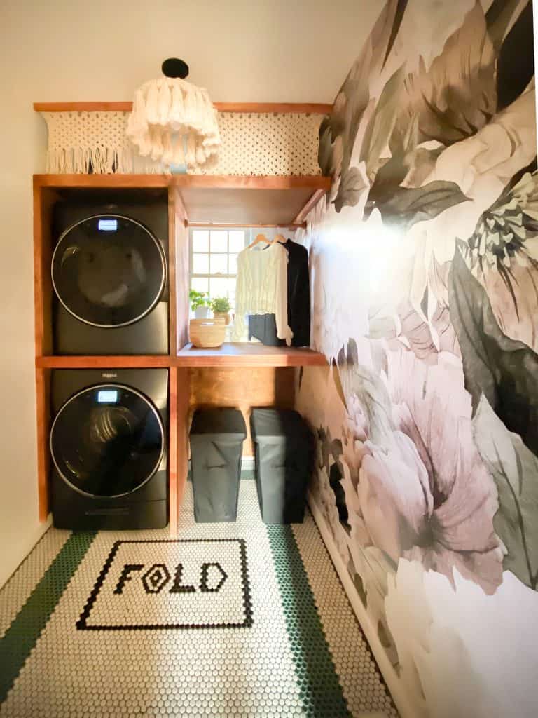 small laundry room with large floral wallpaper