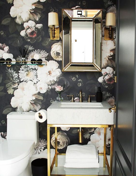 moody powder room with dark floral wallpaper