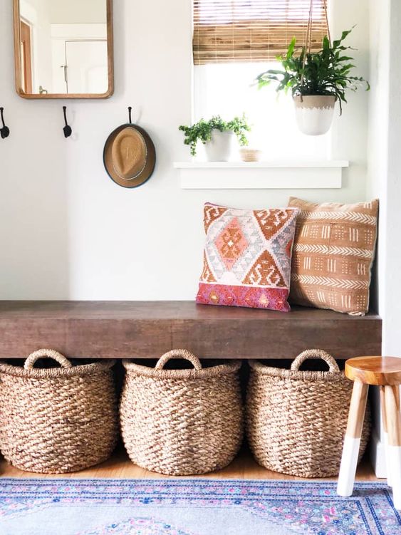 small boho entryway with storage baskets