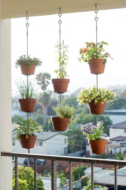 hanging plant pots vertically in small balcony