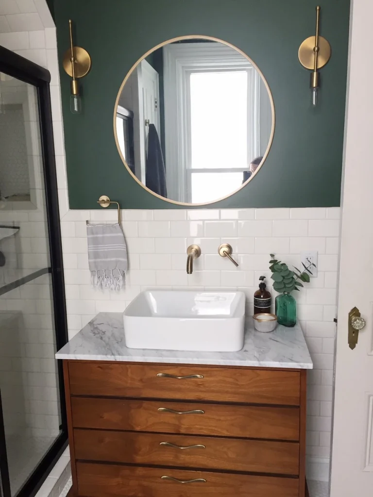 dark green half accent wall in small bathroom